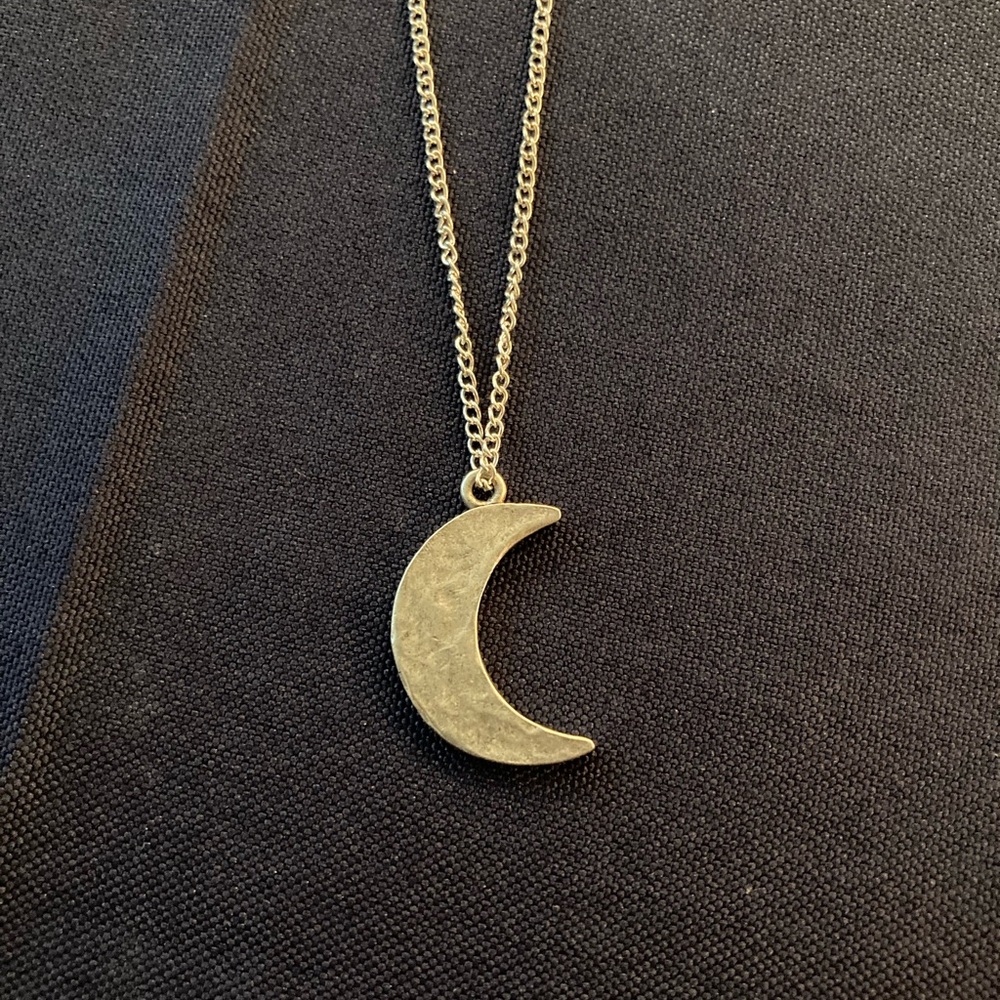 Silver crescent moon necklace with 21” necklace chain.